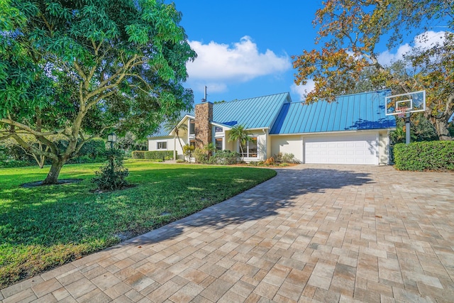 view of front facade with a garage and a front yard