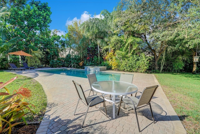 view of swimming pool with a lawn, an in ground hot tub, and a patio