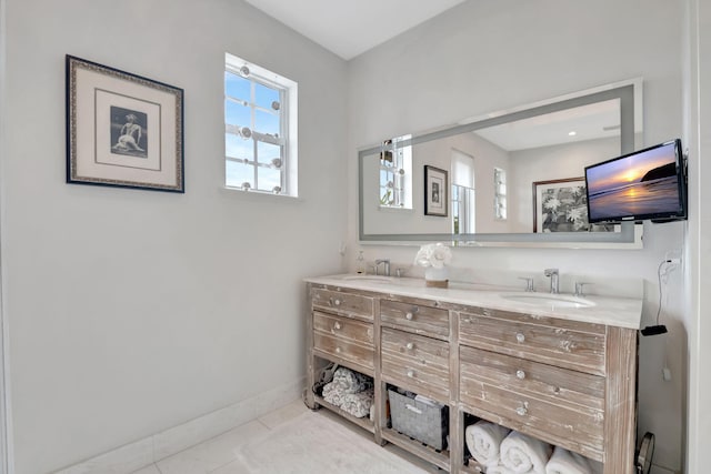 bathroom with tile patterned floors and vanity