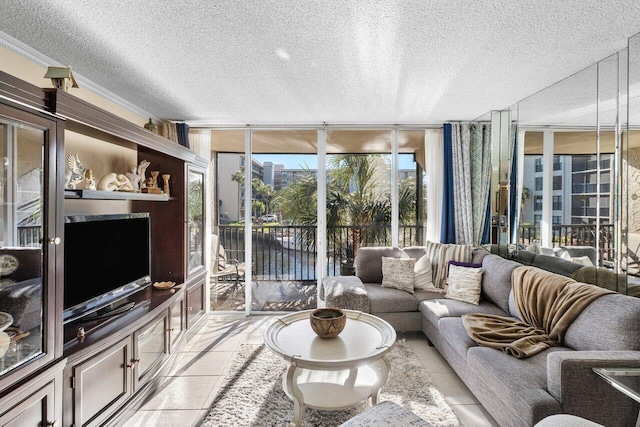 living room with expansive windows, light tile patterned floors, a textured ceiling, and ornamental molding