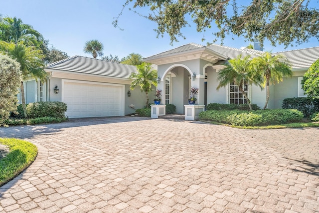 mediterranean / spanish-style house featuring a garage