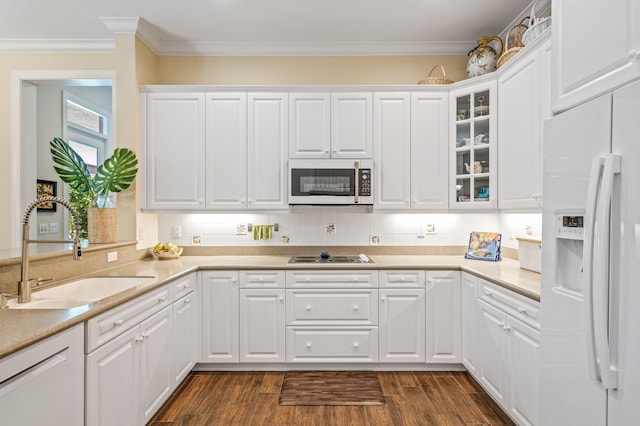 kitchen with white cabinets, dark hardwood / wood-style flooring, white appliances, and sink