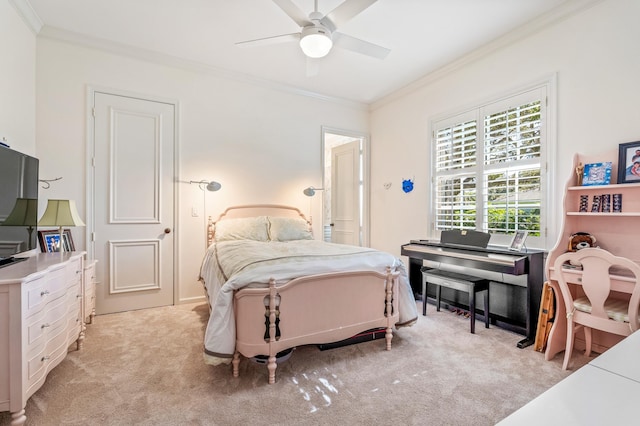 carpeted bedroom with ceiling fan and ornamental molding