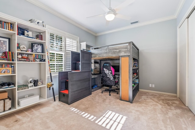 carpeted bedroom featuring a closet, ceiling fan, and ornamental molding