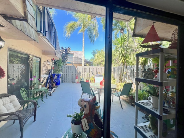 view of patio featuring a balcony