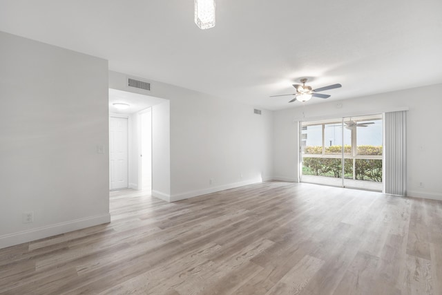 empty room with ceiling fan and light wood-type flooring