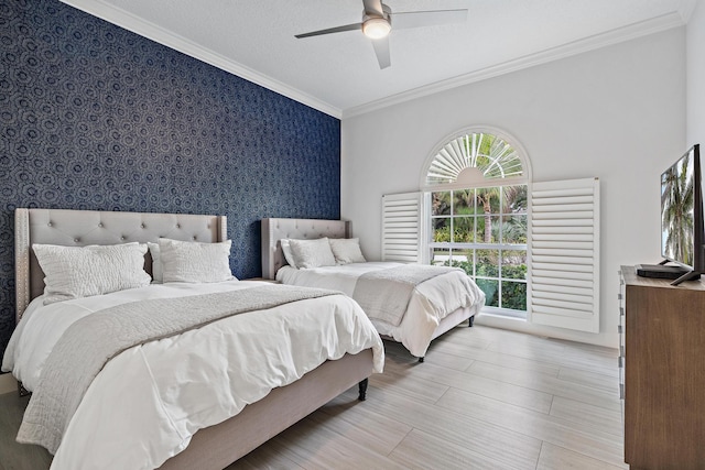 bedroom featuring ceiling fan, crown molding, and light hardwood / wood-style floors