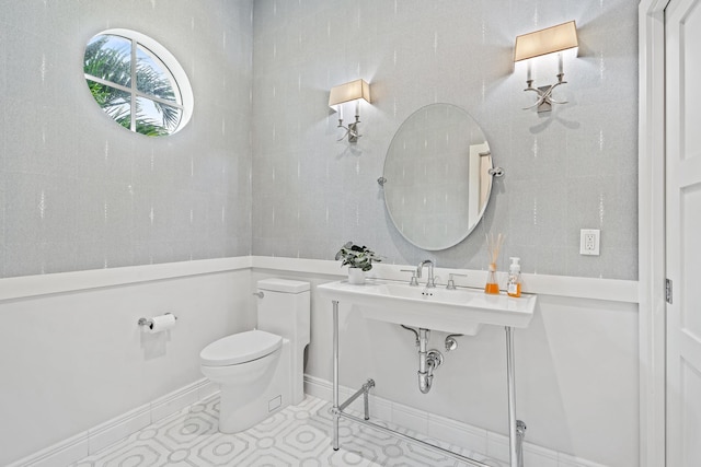 bathroom featuring tile patterned flooring and toilet