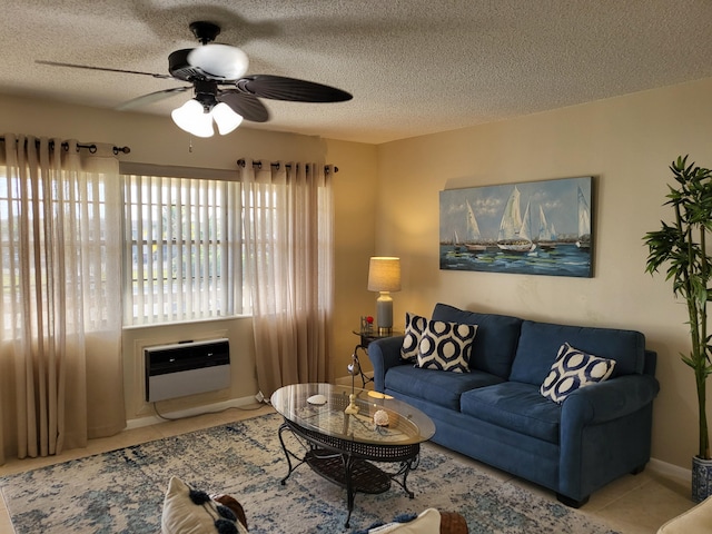 tiled living room featuring ceiling fan, a textured ceiling, and heating unit