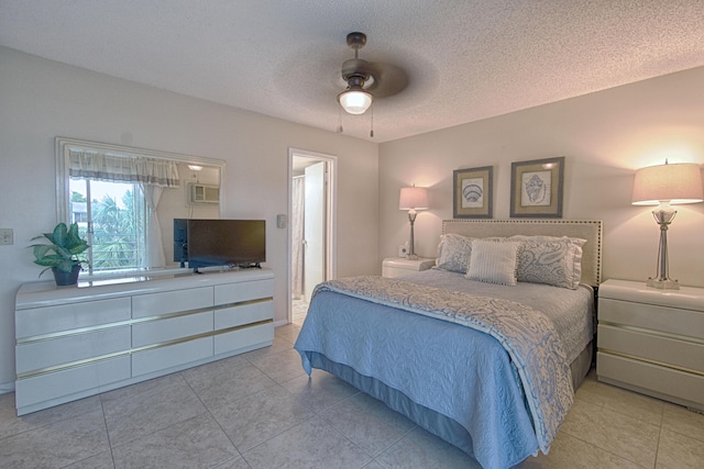 bedroom featuring ceiling fan and a textured ceiling