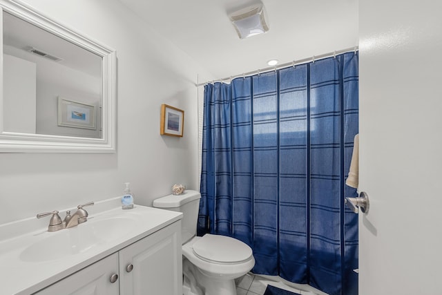 bathroom with tile patterned floors, vanity, and toilet