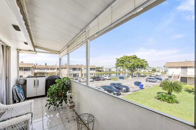 balcony featuring a water view