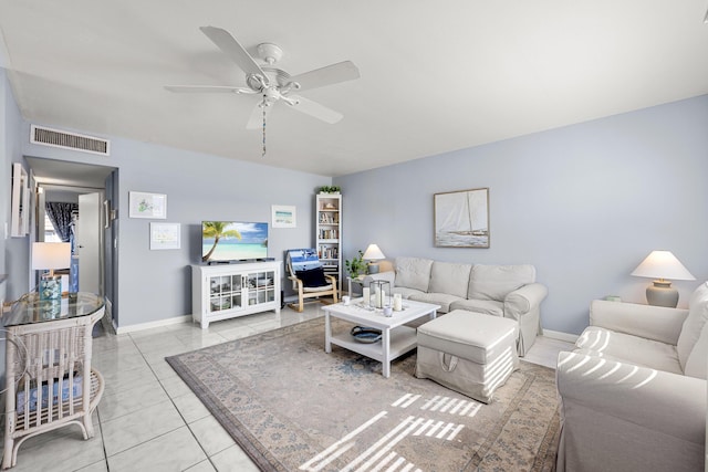 living room featuring ceiling fan and light tile patterned floors