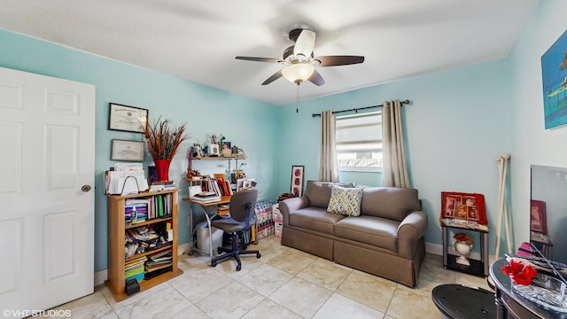 tiled office featuring ceiling fan