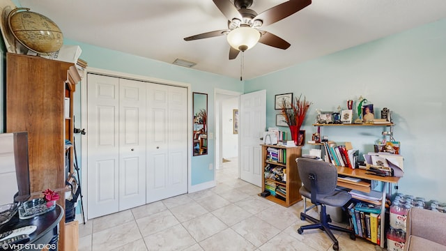 office area with ceiling fan and light tile patterned floors