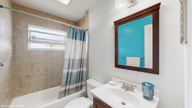 full bathroom featuring toilet, shower / bathtub combination with curtain, and vanity