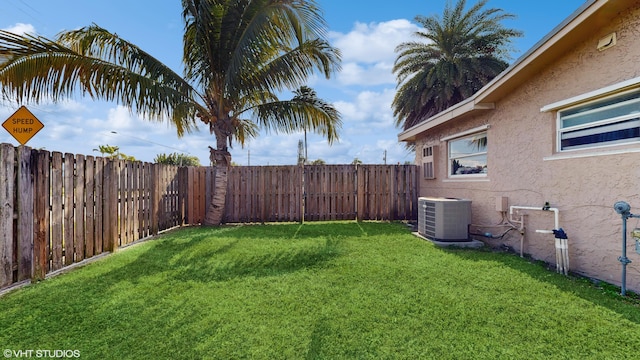 view of yard with central air condition unit