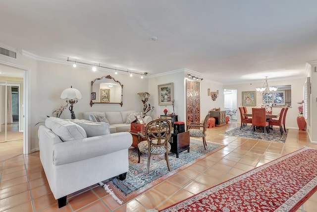 tiled living room with crown molding, rail lighting, and an inviting chandelier