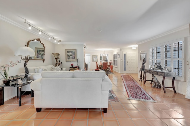 living room featuring ornamental molding and light tile patterned floors