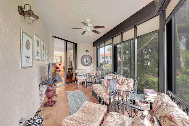 sunroom featuring ceiling fan