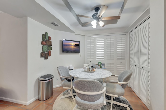 tiled dining room featuring ceiling fan