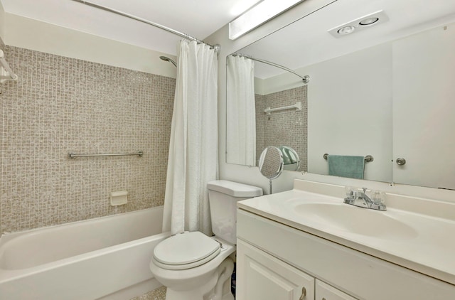 full bathroom featuring vanity, shower / tub combo, and toilet