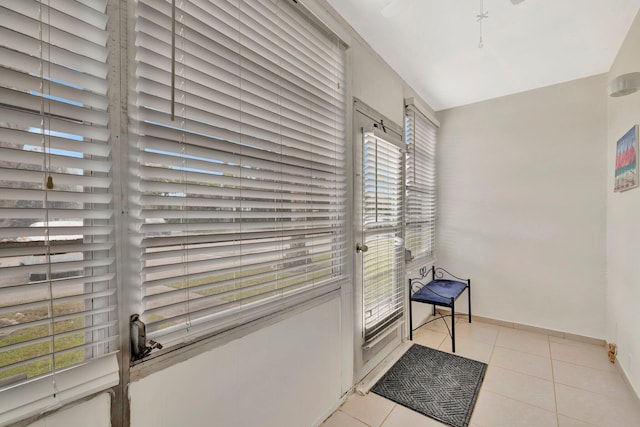 hallway featuring light tile patterned floors