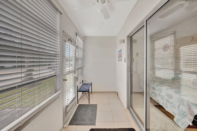 hall featuring light tile patterned floors