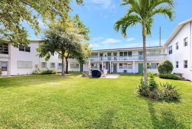 exterior space featuring a yard, a patio, and central air condition unit