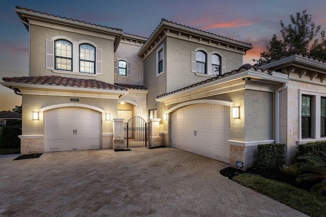 mediterranean / spanish-style house featuring a garage