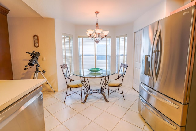 dining room with a notable chandelier and light tile patterned flooring