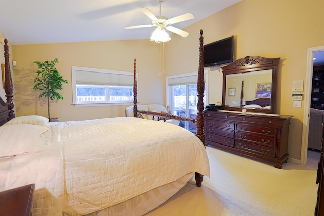 bedroom featuring ceiling fan, light carpet, and lofted ceiling