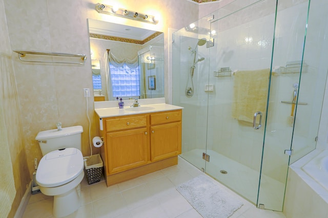 bathroom with tile patterned flooring, vanity, toilet, and a shower with door