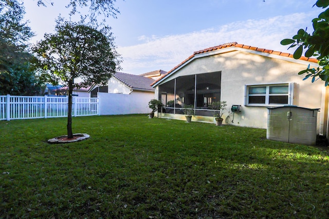 view of yard featuring a sunroom