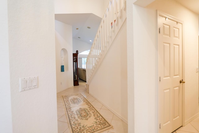 hallway featuring light tile patterned floors