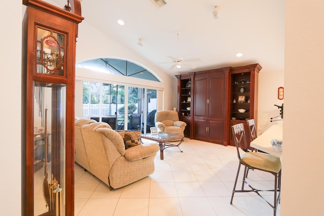 living room featuring high vaulted ceiling, ceiling fan, and light tile patterned flooring