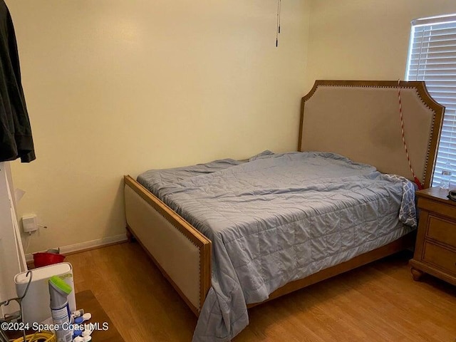 bedroom featuring light wood-type flooring