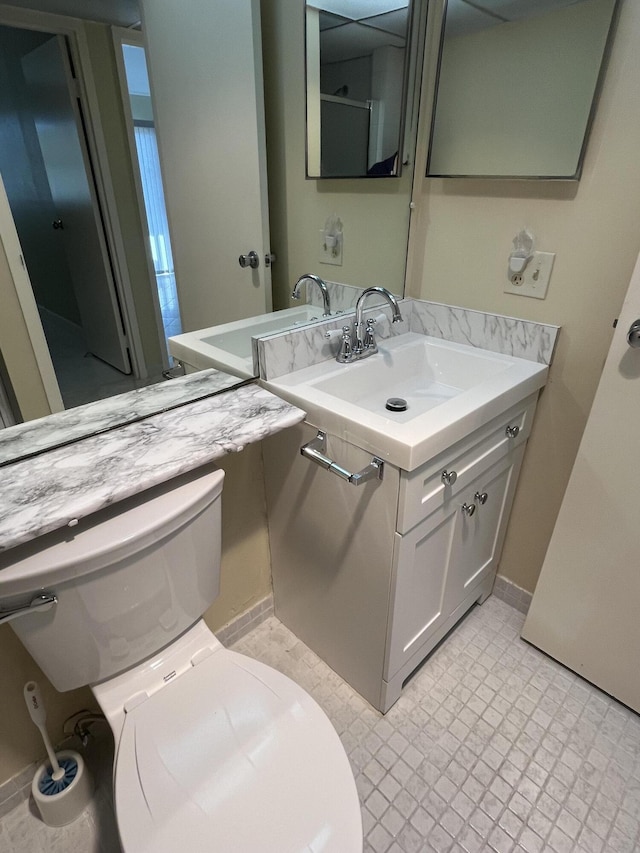 bathroom with vanity and toilet