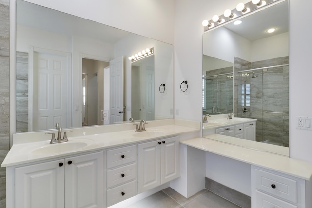 bathroom with tile patterned flooring, vanity, and an enclosed shower