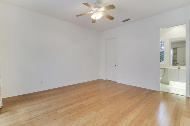 unfurnished room featuring ceiling fan and light wood-type flooring