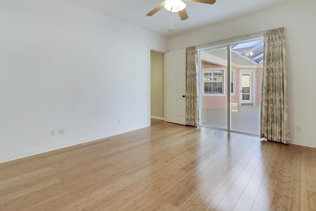 empty room featuring light hardwood / wood-style flooring and ceiling fan