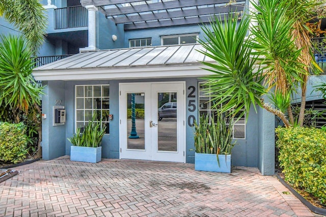 property entrance featuring french doors