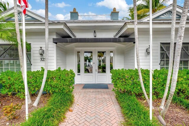 entrance to property featuring french doors