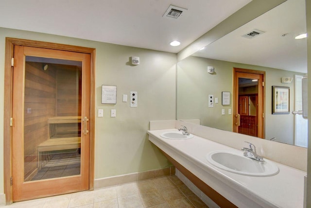 bathroom featuring tile patterned flooring and sink