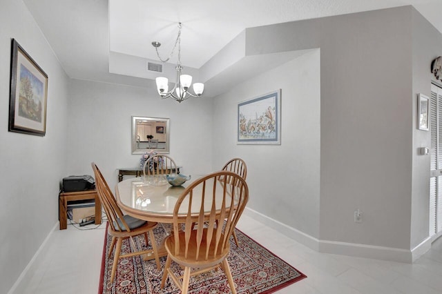 dining space with a notable chandelier