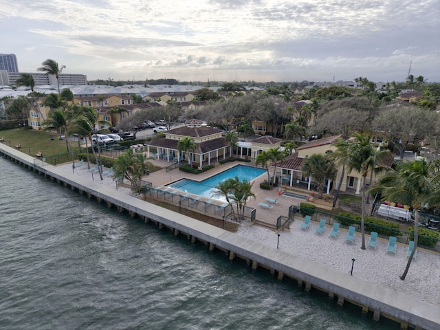 birds eye view of property with a water view