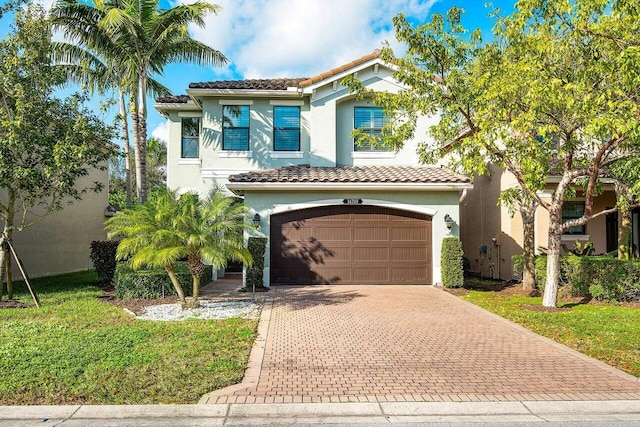 mediterranean / spanish-style home with a garage