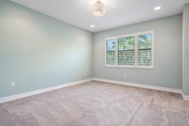 empty room featuring carpet flooring