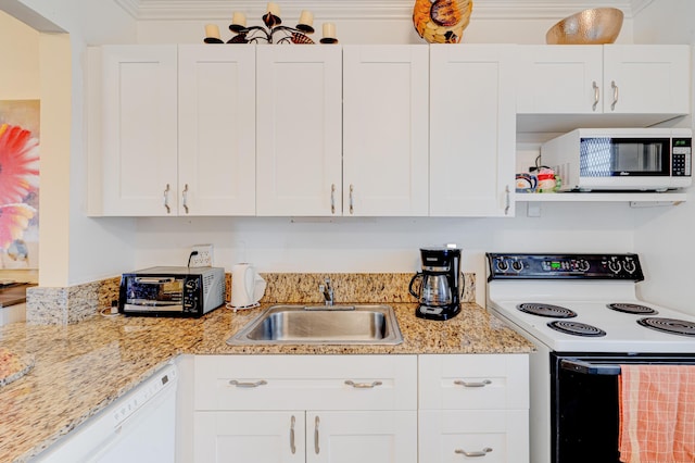 kitchen featuring white cabinets, white appliances, and sink