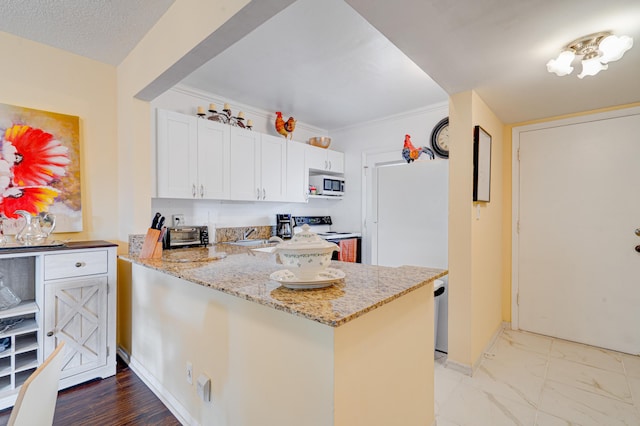 kitchen featuring white cabinets, crown molding, electric range, light stone counters, and kitchen peninsula